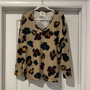 Light brown with colorful print. Boutique.